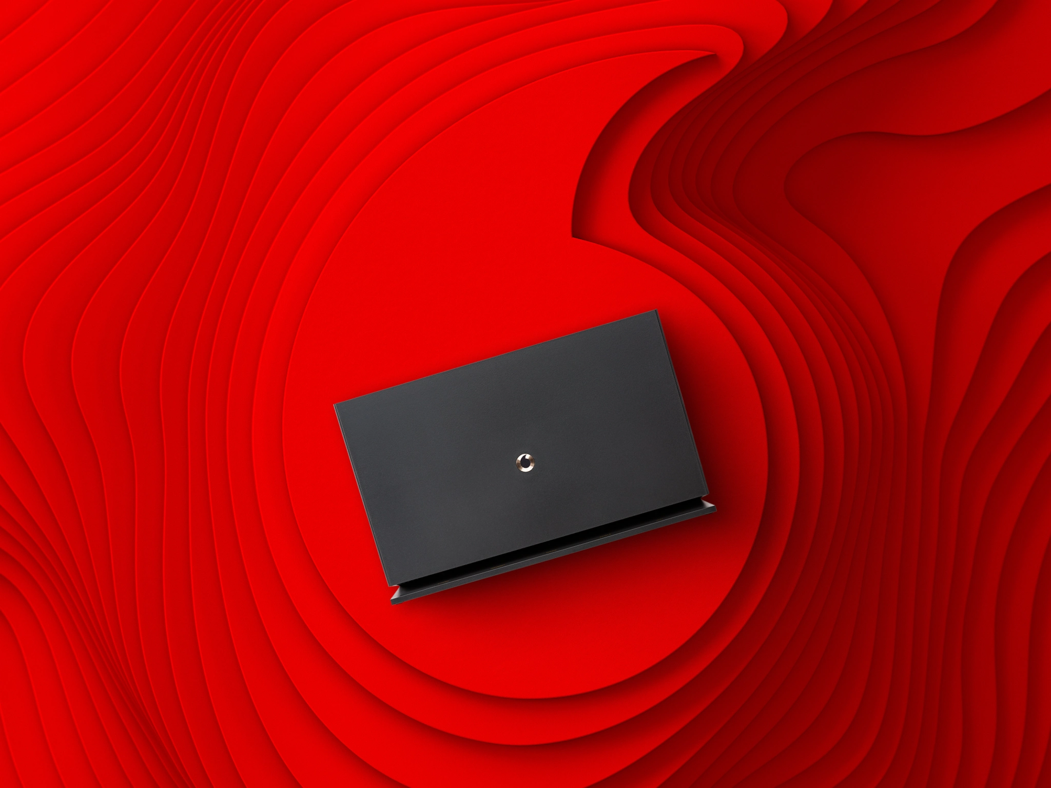 Vodafone basics router on a red Vodafone branded background.